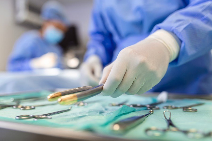 Laparoscopic surgeon using surgical instruments during a medical procedure