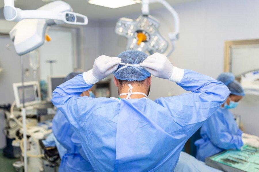 Surgeon preparing for a surgical procedure in a hospital operating room